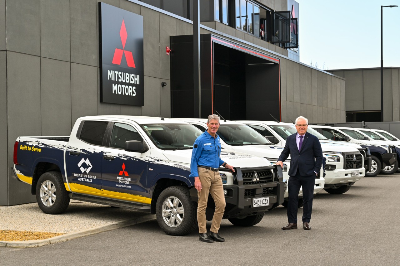 Mitsubishi Motors Australia CEO Shaun Westcott hands over new Triton fleet to DRA CEO David Smith and his team. 